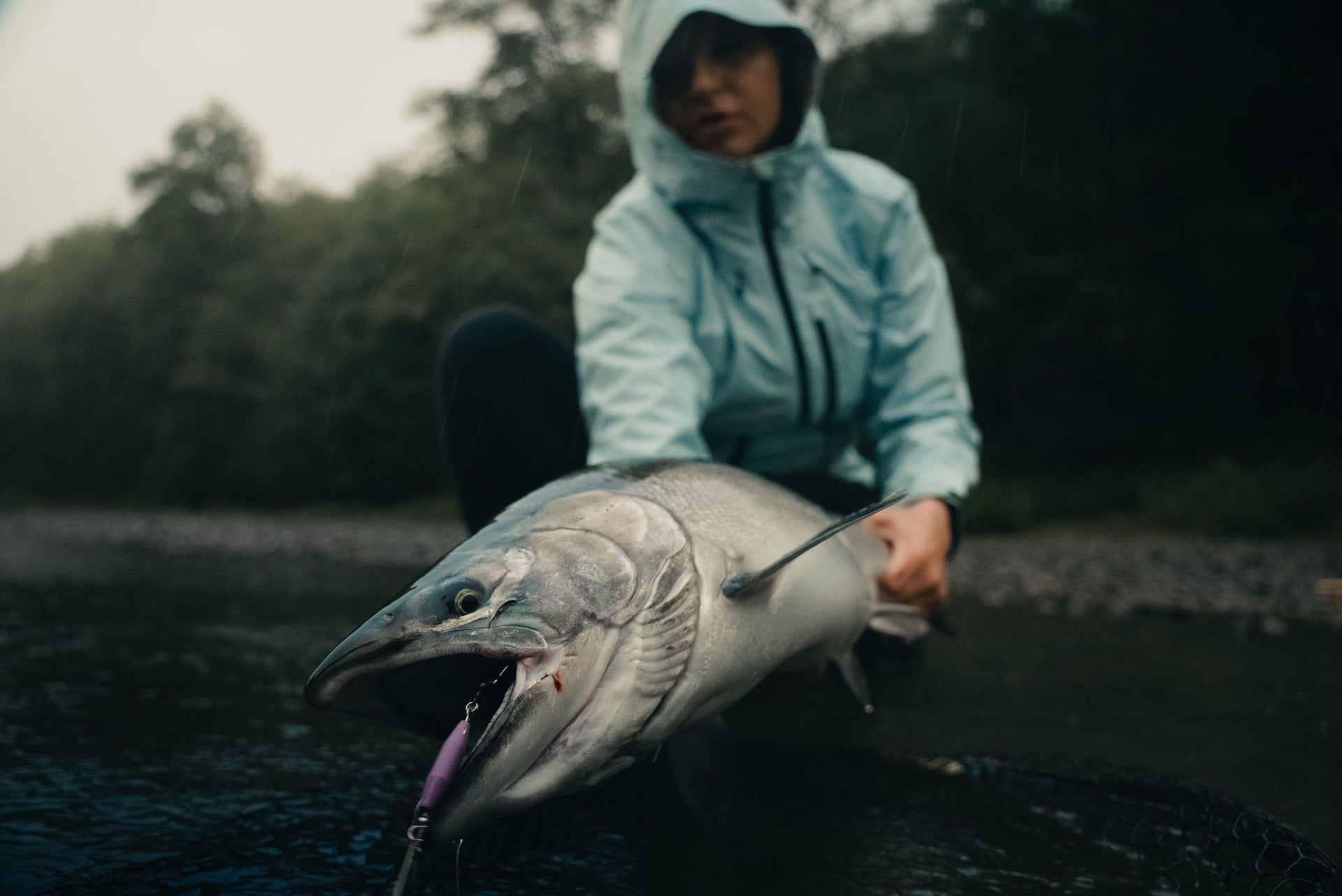 Woman holding a caught fish