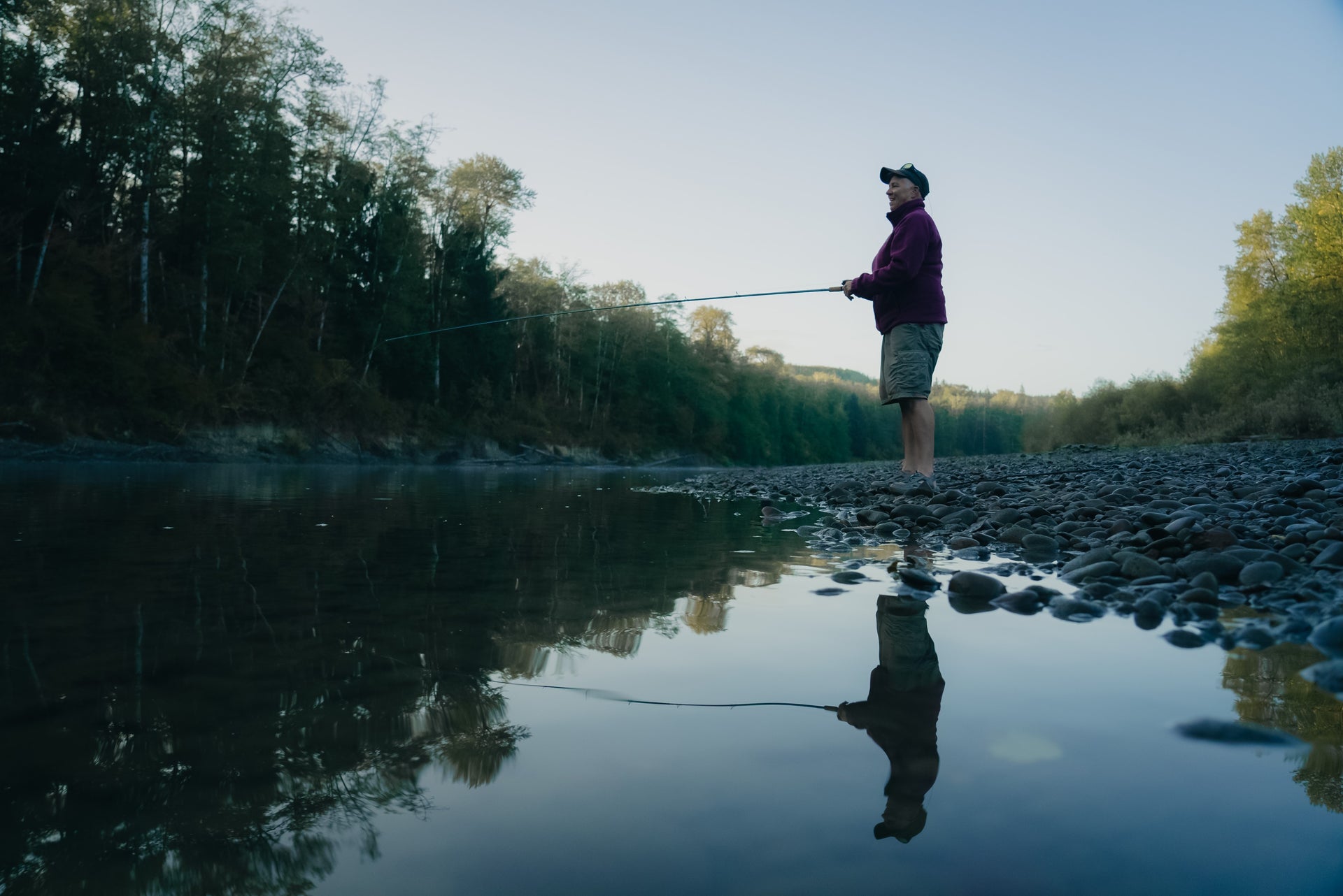 Woman fishing on the shoreline