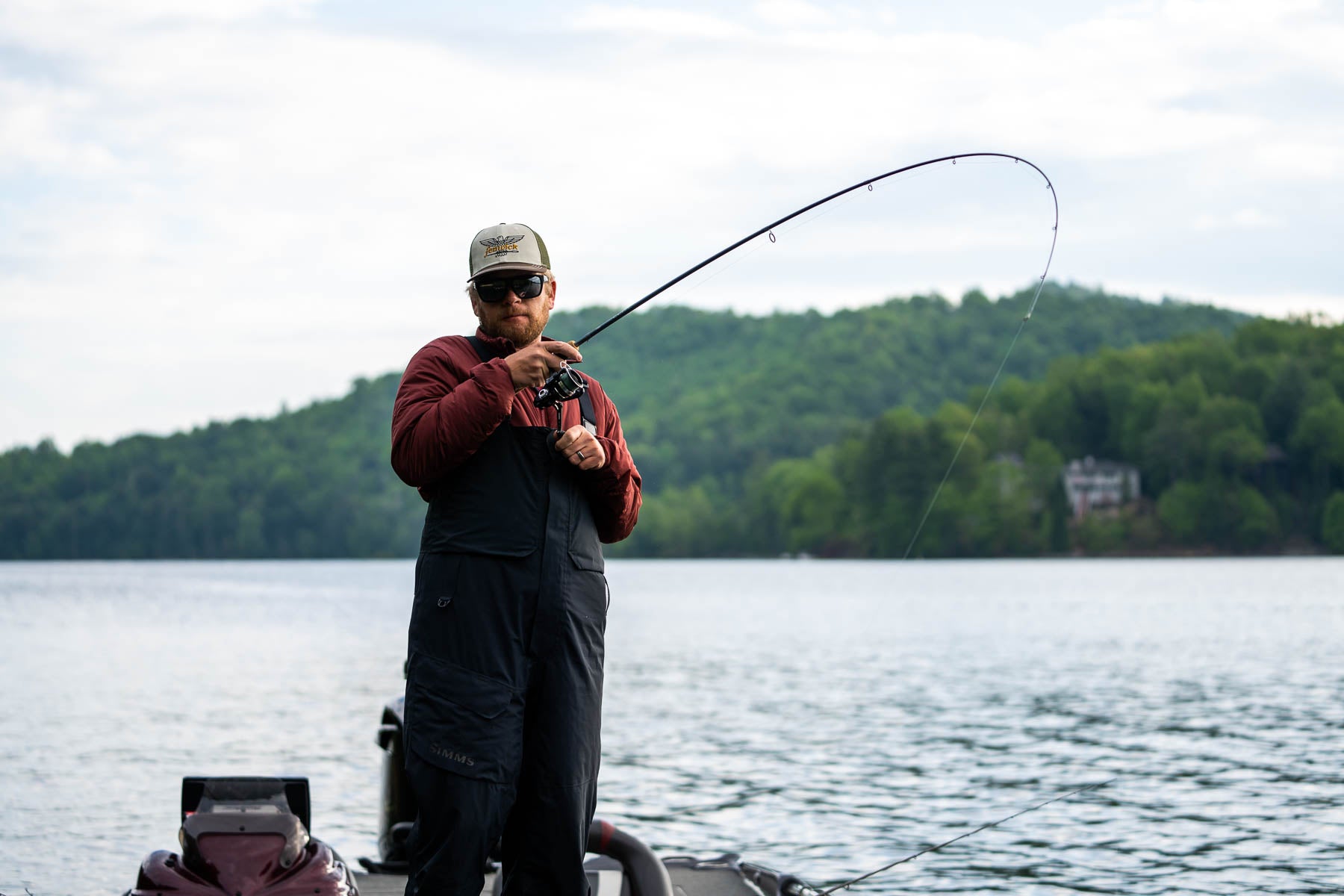 Man wearing Fenwick hat fishing